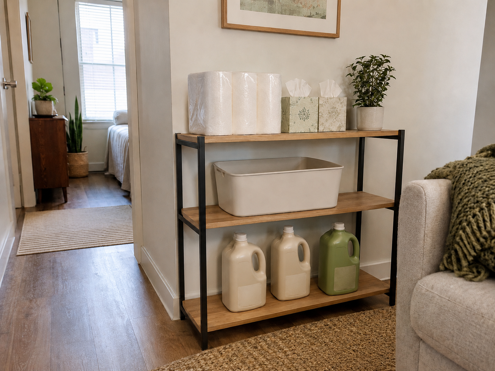 Light paper towels and tissues stored above three sealed refill jugs on a stable compact shelf with clear floor access.