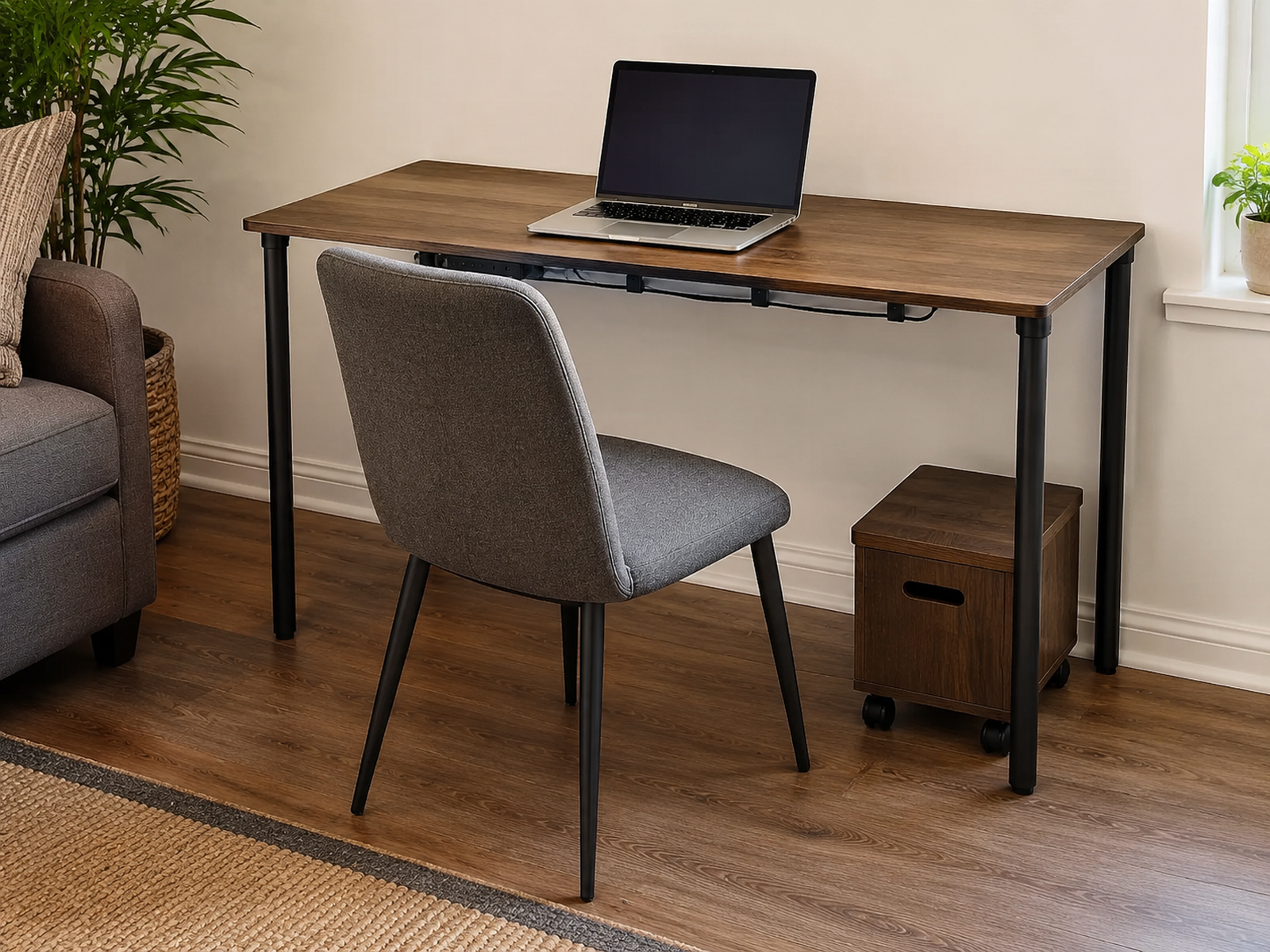 Compact rolling file unit positioned beside the under-desk knee zone with chair movement, foot space, and rear cable clearance preserved.